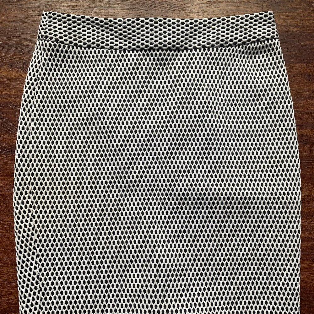 Banana Republic form fitting black skirt with white eyelet overlay